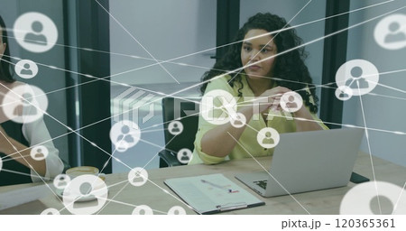 Image of network of connections with people icons over diverse business people in office Image of network of connections with people icons over diverse business people in office 120365361