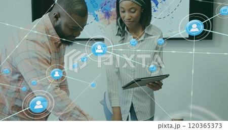 Image of network of connections with people icons over diverse business people in office Image of network of connections with people icons over diverse business people in office 120365373