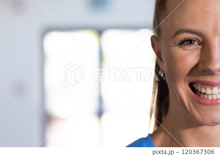 Smiling woman in sportswear, showing happiness and confidence in basketball setting, copy space 120367306