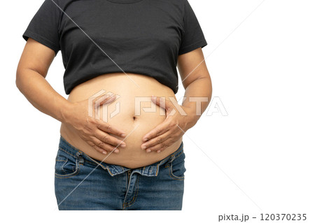 Overweight Asian woman show fat belly in body isolated on white background with copy space. Overweight Asian woman show fat belly in body isolated on white background with copy space. 120370235