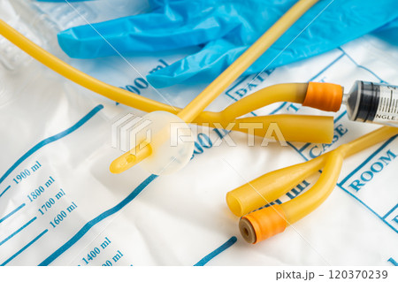 Foley urinary catheter with urine bag for disability or patient in hospital. 120370239