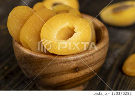 sweet dried pieces of pitted apricots and juicy fresh apricots 120370283