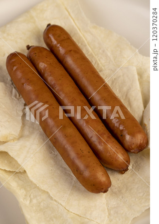 fried pork sausages on a wheat tortilla fried pork sausages on a wheat tortilla 120370284