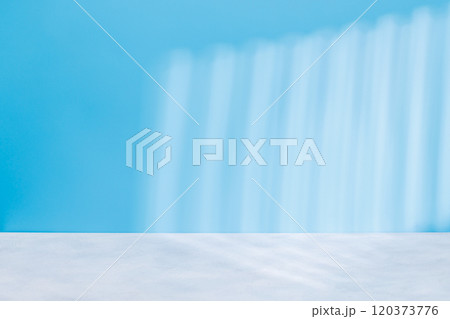 Wooden table and sunlit wall, product template Wooden table and sunlit wall, product template 120373776