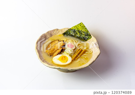 A delicious bowl of ramen being prepared  120374089