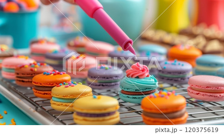 Colorful Macarons Being Decorated in a Bright Kitchen During a Fun Baking Activity 120375619