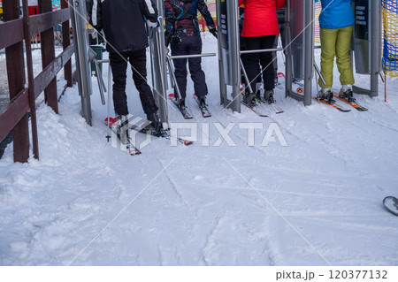 Skiers in Line at a Snowy Ski Resort 120377132