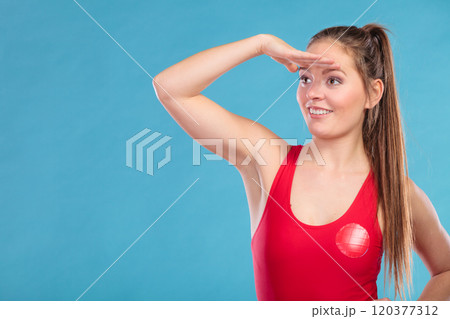 Lifeguard woman looking out into the distance. 120377312