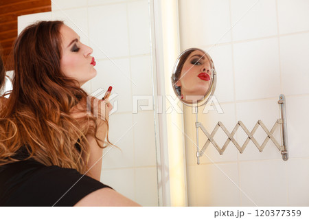 Young girl making makeup Young girl making makeup 120377359