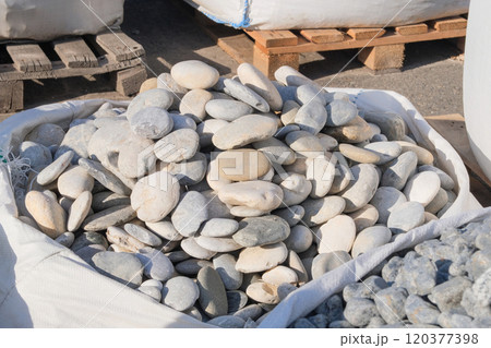 Sea pebbles Decorative stones are sold in construction market. Natural stone material for decoration and construction. Sea pebbles Decorative stones are sold in construction market. Natural stone material for decoration and construction. 120377398