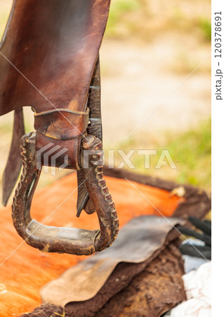 Detailed close up of horse saddle with stirrup 120378691