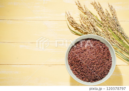View from above of red rice in a bowl and ears of rice View from above of red rice in a bowl and ears of rice 120378797