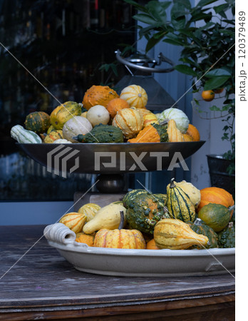 Autmn Gourds And pumpkins decorations in large bowls. 120379489