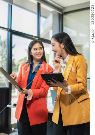 Successful team businesswoman with inspiration from their excellent financial results. Successful team businesswoman with inspiration from their excellent financial results. 120380528