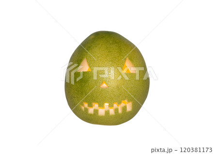 Scary face carved in pomelo fruit with candle inside isolated in white background 120381173