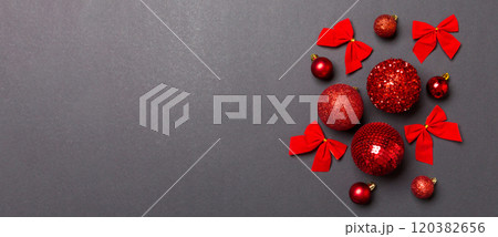Top view of festive winter composition on colorful background with empty space for your design. Christmas baubles and decorations. New Year concept 120382656