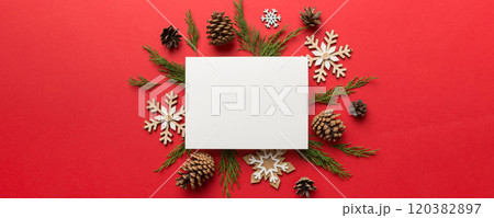 Flat lay Christmas composition. square Paper blank, pine tree branches, christmas decorations on Colored background. Top view, copy space for text Flat lay Christmas composition. square Paper blank, pine tree branches, christmas decorations on Colored background. Top view, copy space for text 120382897