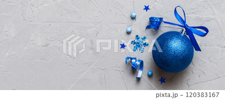 Christmas ball on colored background. decoration bauble with ribbon bow with copy space Christmas ball on colored background. decoration bauble with ribbon bow with copy space 120383167