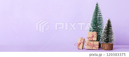 Christmas composition. Gifts, small tree, branches and craft DIY decorations on white background. New year concept. Christmas home decoration Flat lay, top view, copy space 120383375