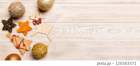 Winter set made of Christmas balls and various decorations on holiday wooden background. Top view of New Year concept with copy space 120383571