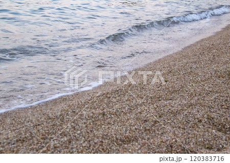 The beach with sea waves running on the sand. Beautiful view on the waves The beach with sea waves running on the sand. Beautiful view on the waves 120383716