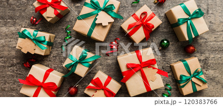 Colored craft gift boxes with colorful ribbons on colored background. Collection of Christmas present boxes Colored craft gift boxes with colorful ribbons on colored background. Collection of Christmas present boxes 120383766