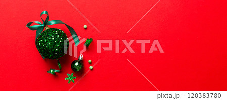 Christmas ball on colored background. decoration bauble with ribbon bow with copy space 120383780