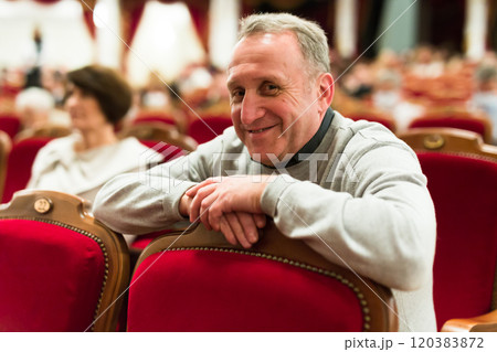 Mature man in theater watching a performance 120383872