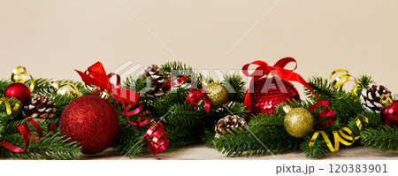 New Year Christmas tree toy, branches of a christmas tree, New Year decorations on a colored background 120383901