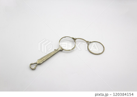 Old vintage lorgnette from the middle of the nineteenth century on the white background Old vintage lorgnette from the middle of the nineteenth century on the white background 120384154