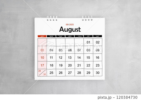 August 2025 desk calendar on gray cement wall background. August 2025 desk calendar on gray cement wall background. 120384730