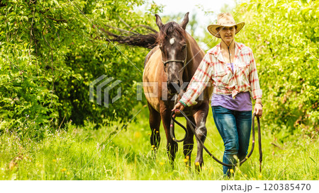 Western cowgirl woman with horse. Sport activity 120385470