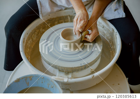 Engaging in Artisan Pottery Crafting Using a Wheel for Unique and Stylish Creations 120385613