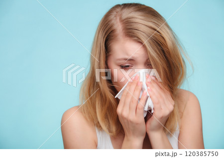 Flu allergy. Sick girl sneezing in tissue. Health Flu allergy. Sick girl sneezing in tissue. Health 120385750