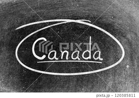 White chalk hand writing in word canada and circle shape on blackboard background White chalk hand writing in word canada and circle shape on blackboard background 120385811