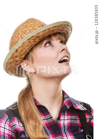 Shocked and surprised gardener woman looking up Shocked and surprised gardener woman looking up 120385935