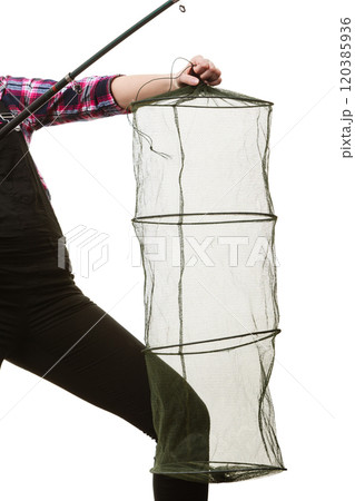Woman hand holding empty fishing keepnet and rod Woman hand holding empty fishing keepnet and rod 120385936