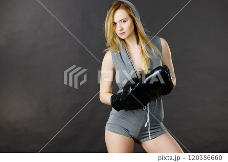 Boxer girl exercise with boxing gloves. 120386660