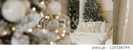 Banner bright modern bedroom with a large Christmas tree 120386744