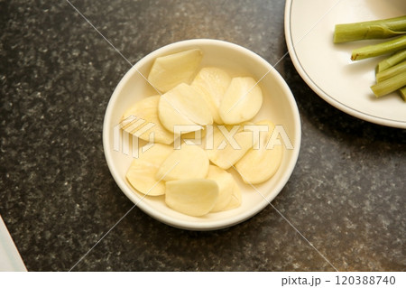 sliced garlic on a plate sliced garlic on a plate 120388740