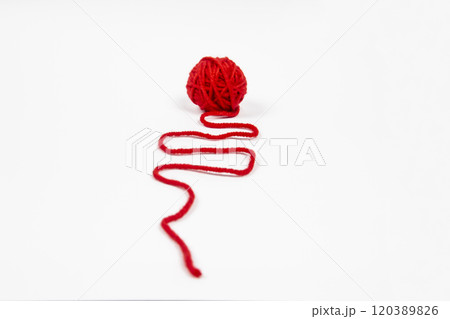 Red skein of thread against white background. Red ball of wool red thread isolated on white 120389826