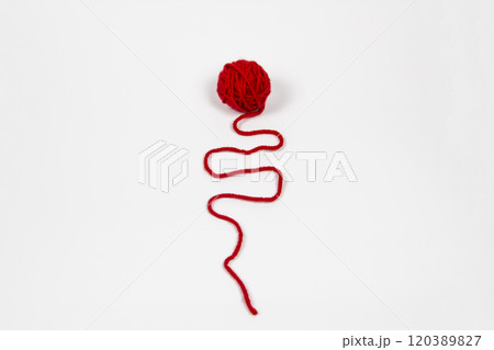 Red skein of thread against white background. Red ball of wool red thread isolated on white Red skein of thread against white background. Red ball of wool red thread isolated on white 120389827