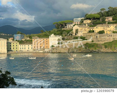 View from rock on Bay of Silence, fishing cove of town of Sestri-Levante, Italy. Tourism and recreation. Ecologically clean nature. Traditional old buildings. Historical center. View from rock on Bay of Silence, fishing cove of town of Sestri-Levante, Italy. Tourism and recreation. Ecologically clean nature. Traditional old buildings. Historical center. 120390079
