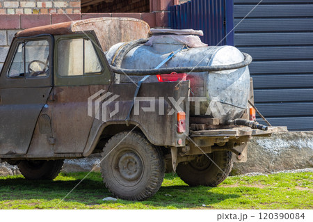 old soviet 4x4 converted to a pickup with barrel for small farmers milk collection 120390084
