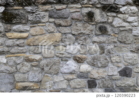 The background with stones. Stone wall background.  Old wall cement texture. 120390223