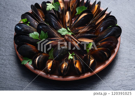 Mussels with parsley on a plate photography Mussels with parsley on a plate photography 120391025