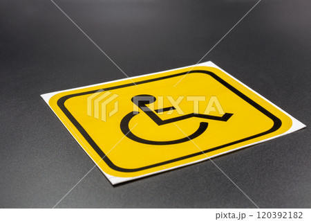 Disability sign for placement on a vehicle closeup. 120392182