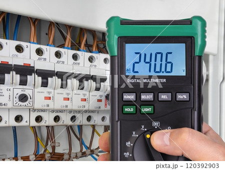 Digital Multimeter Reading Voltage in Electrical Panel Digital Multimeter Reading Voltage in Electrical Panel 120392903