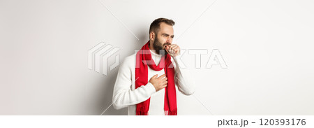 Christmas holidays and celebration concept. Man feeling sick, coughing and grimacing from sore throat, covid-19 symptoms at new year eve, standing over white background 120393176
