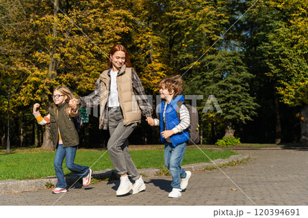 Children walking outdoors in social gathering in park enjoying free time together with fun Children walking outdoors in social gathering in park enjoying free time together with fun 120394691